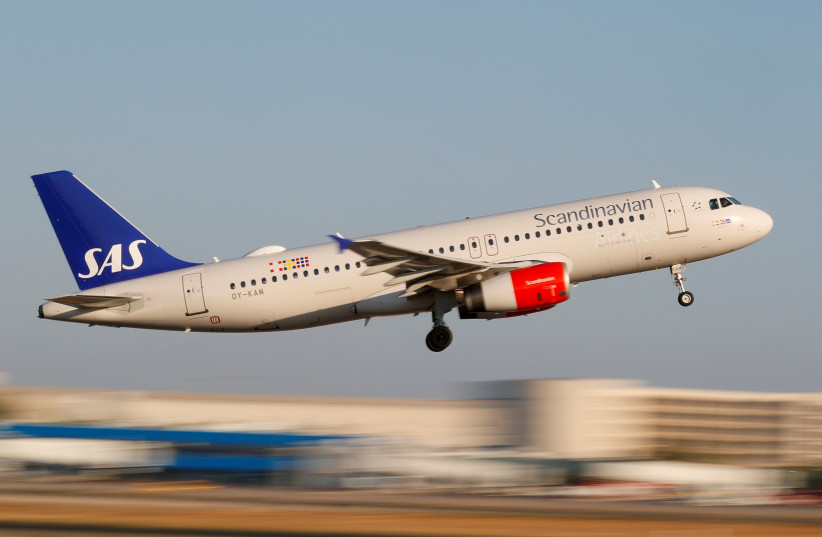 A Scandanavian Airlines, known as SAS, Airbus A320-200 airplane takes off from the airport in Palma de Mallorca, Spain, July 29, 2018. (photo credit: REUTERS/PAUL HANNA/FILE PHOTO)