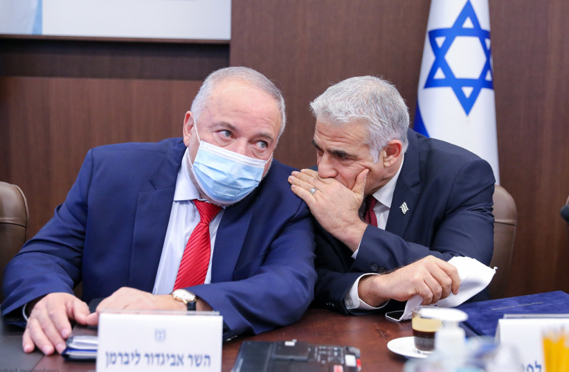 Foreign Minister Yair Lapid and Finance Minister Avigdor Liberman at the cabinet meeting, November 7, 2021.  (photo credit: MARC ISRAEL SELLEM/THE JERUSALEM POST)