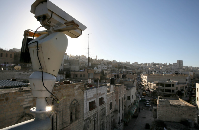  A security camera seen overlooking the West Bank city of Hebron. January 15, 2013 (photo credit: NATI SHOHAT/FLASH90)