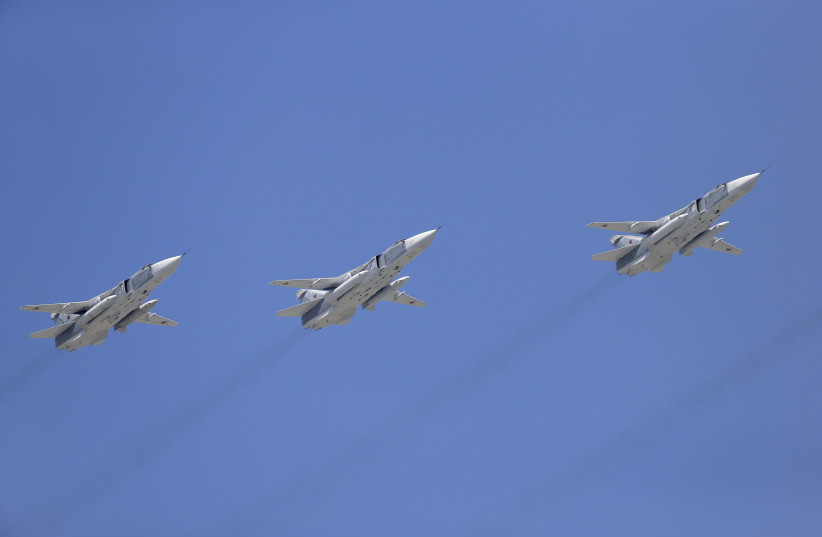 Tupolev Tu-22M3 Backfire strategic bombers fly in formation over the Red Square during the Victory Day parade in Moscow, Russia, May 9, 2015. (photo credit: REUTERS/HOST PHOTO AGENCY/RIA NOVOSTI)