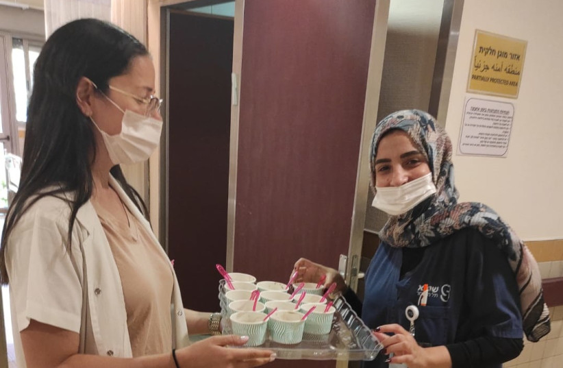 Sheba Medical Center staff get ready to serve vitamin ice cream. (photo credit: NAAMA FRANK AZRIEL)