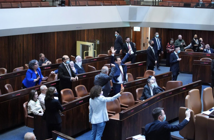  Opposition MKs celebrate the passing of the preliminary reading of a bill (photo credit: DANNY SHEMTOV/KNESSET SPOKESPERSON'S OFFICE)
