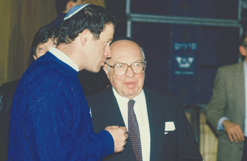  YOSEF BURG, a founding member and chairman of the National Religious Party, with his son Avraham Burg, in a photo from the 1980s.  (photo credit: MOSHE SHAI/FLASH90)