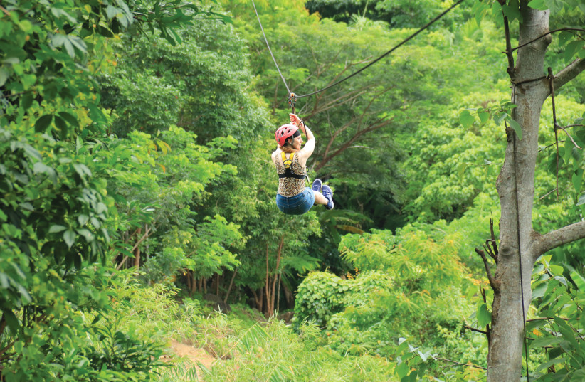  ZIPLINING HIGH above the rainforest at Hanuman World.  (credit: HANUAN WORLD PHUKET)