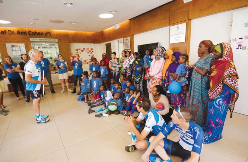 Adams and the cycling academy at the SACH children’s home. (credit: SACH)