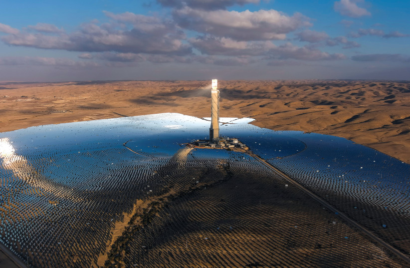  A photograph taken with a drone of a solar power tower on a solar farm near Kibbutz Ashalim in the Negev desert on October 23. (credit: ILAN ROSENBERG/REUTERS)
