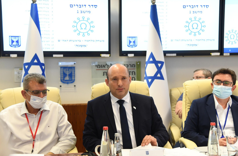 Israel's Prime Minister Naftali Bennett is seen following the completion of the COVID-19 'war games' exercise. (photo credit: HAIM ZACH/GPO)