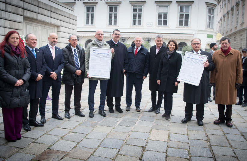 Officials of the Austrian Football Association (OFB) and the Austrian Football League (Bundesliga) adopt the International Holocaust Remembrance Alliance’s working definition on antisemitism on Thursday during a ceremony at the Judenplatz in Vienna. (photo credit: HBF/Pusch)