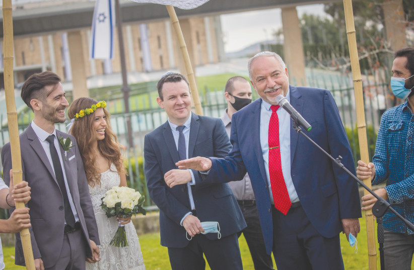  YISRAEL BEYTENU chairman Avigdor Liberman presides over a civil marriage outside the Knesset, last year. (photo credit: YONATAN SINDEL/FLASH90)