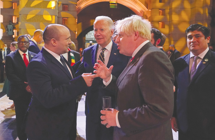  PRIME MINISTER Naftali Bennett, US President Joe Biden and Britain’s Prime Minister Boris Johnson attend a reception at the UN Climate Change Conference (COP26), in Glasgow earlier this month.  (photo credit: Alberto Pezzali/Reuters)