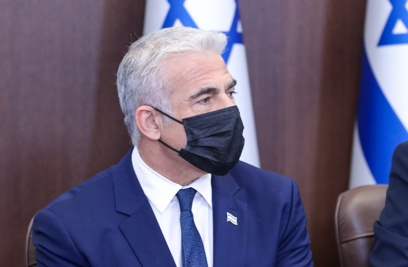 Foreign Minister Yair Lapid at the cabinet meeting on November 14, 2021 (credit: MARC ISRAEL SELLEM/POOL)