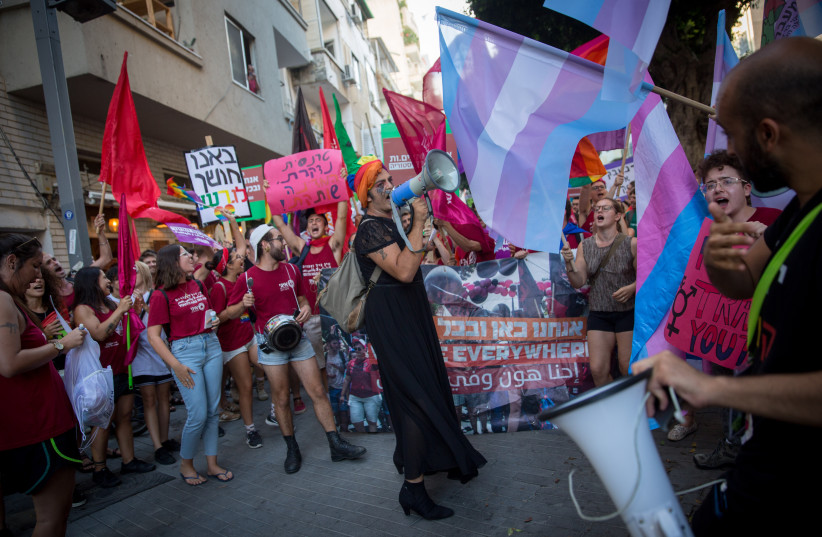  Members of the LGBTQ+ community and supporters participate in a protest march in support of the transgender community, in Tel Aviv on July 22, 2018. (photo credit: MIRIAM ALSTER/FLASH90)