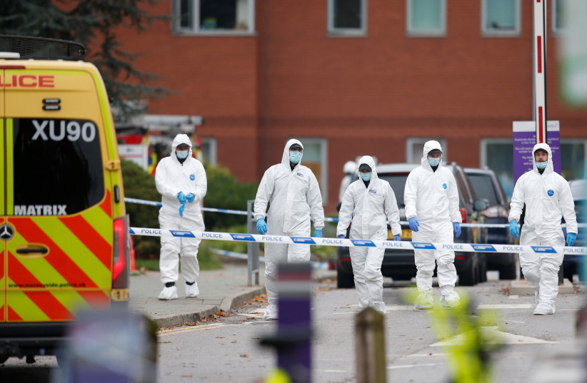  Forensic officers work outside Liverpool Women's Hospital, following a car blast, in Liverpool, Britain, November 15, 2021 (photo credit: REUTERS/ED SYKES)