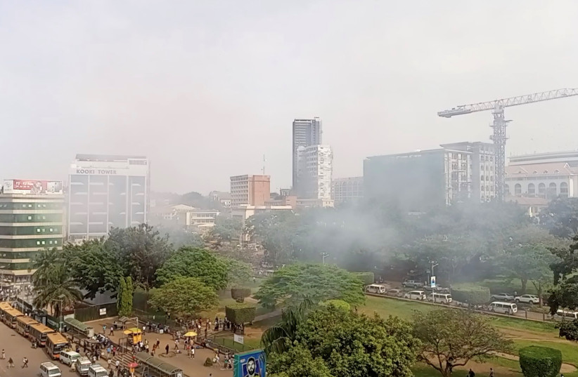  Smoke rises near the blast area, in Kampala, Uganda, November 16, 2021, in this still image obtained from a social media video. (photo credit: SSENYONYO UMARU/VIA REUTERS)