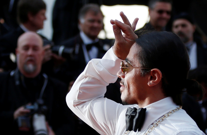  Nusret Gokce, known as Salt Bae, poses at the 72nd Cannes Film Festival (photo credit: REUTERS/STEPHANE MAHE)