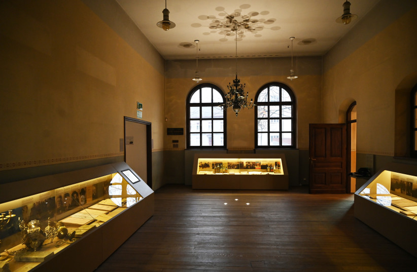  The permanent exhibition at the Auschwitz Jewish Center in Oswiecim, Poland features expensive chandeliers that local Jews might have hid under the floorboards. (credit: CNAAN LIPHSHIZ/JTA)