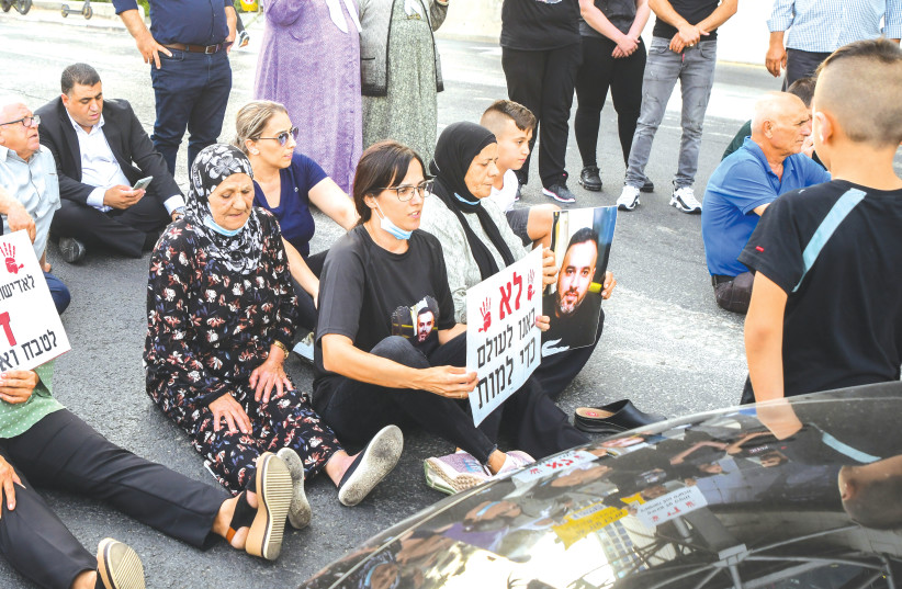  ISRAELI-ARABS BLOCK a road in Tel Aviv during a protest last month against violence, organized crime and recent killings in their communities. (photo credit: AVSHALOM SASSONI/FLASH90)