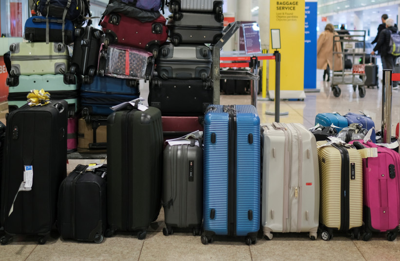  Suitcases are seen at Josep Tarradellas Barcelona-El Prat Airport, in Barcelona, Spain, November 19, 2021. (credit: NACHO DOCE/REUTERS)