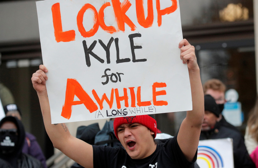  Protesters demonstrate outside the Kenosha County Courthouse, during the trial of Kyle Rittenhouse, in Kenosha, Wisconsin, US, November 17, 2021.  (credit: BRENDAN MCDERMID/REUTERS)