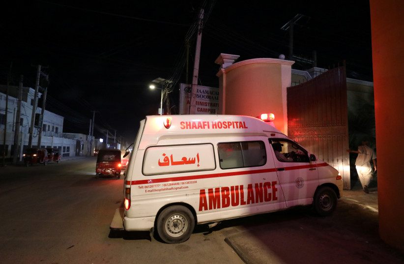 An ambulance carrying an injured person from an attack by Al Shabaab gunmen on a hotel near the presidential residence arrives to the Shaafi hospital in Mogadishu, Somalia, December 10, 2019. (credit: REUTERS/FEISAL OMAR)