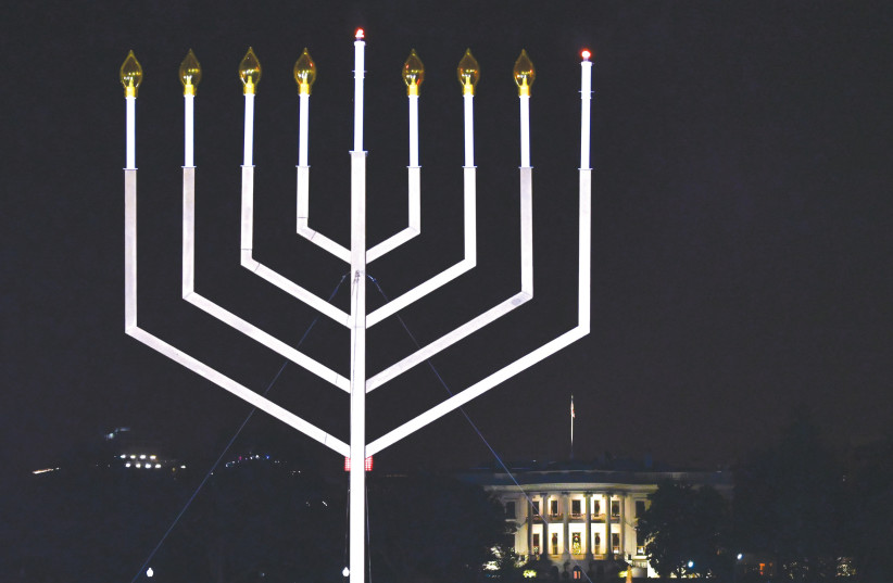  THE 2020 National Menorah is lit near the White House last December. (credit: ERIN SCOTT/REUTERS)
