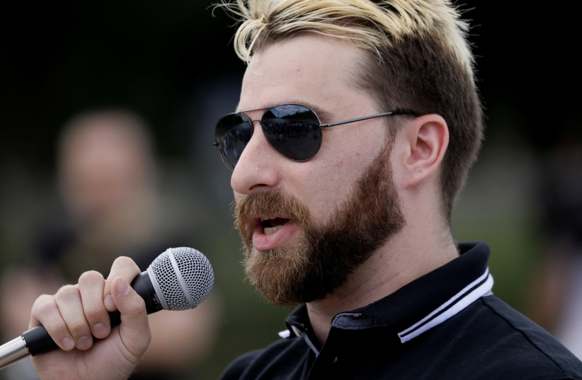  Activist Tim Gionet, who goes by the name ''Baked Alaska'' on the internet, addresses a rally of self-proclaimed White Nationalists and ''alt-right'' supporters at what they called a ''Freedom of Speech'' rally on the steps of the Lincoln Memorial in Washington, June 25, 2017. (credit: JIM BOURG / REUTERS)