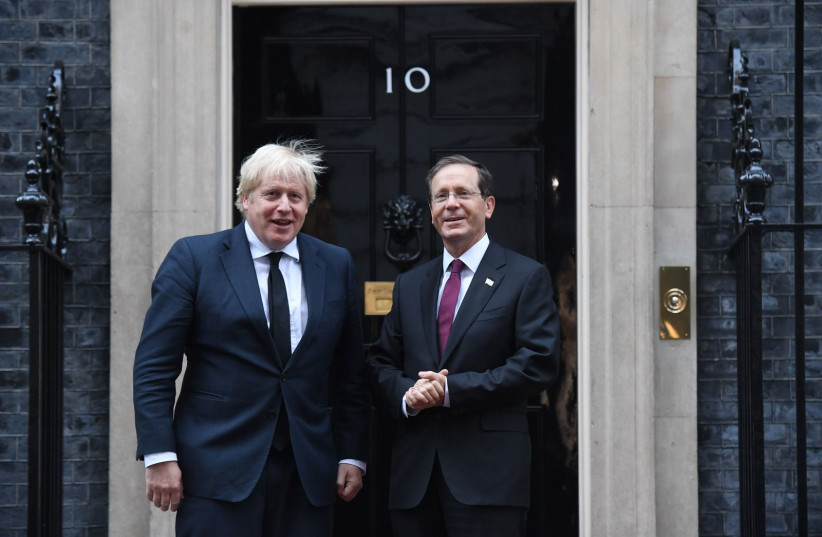 President Isaac Herzog meets with British PM Johnson in London on November 23, 2021.  (photo credit: KOBI GIDEON/GPO)