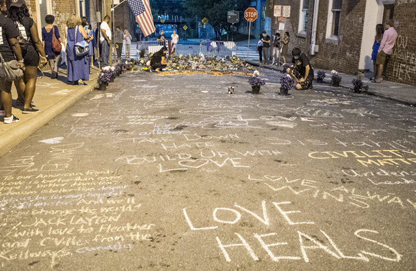  A memorial for Heather Heyer who was killed. On August 12, 2017, a car was deliberately driven into a crowd of people who had been peacefully protesting the Unite the Right rally in Charlottesville, Virginia, killing one and injuring 28.  (credit: GETTY IMAGES)