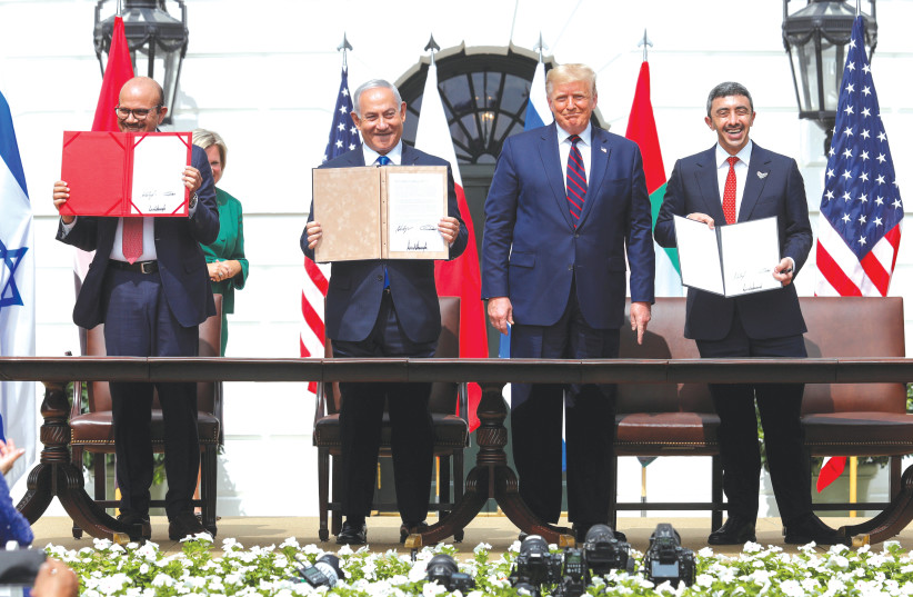  FORMER PRIME MINISTER Benjamin Netanyahu with the Bahraini and UAE foreign ministers after signing the Abraham Accords at the White House in September of last year, as FORMER US president Donald Trump looks on. (photo credit: TOM BRENNER/REUTERS)