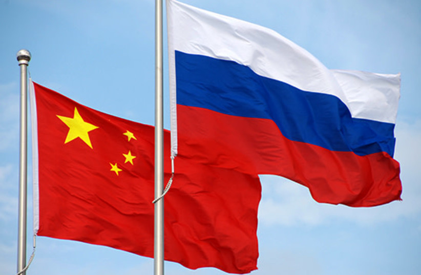  Russian and Chinese flags. (credit: WIKIMEDIA)