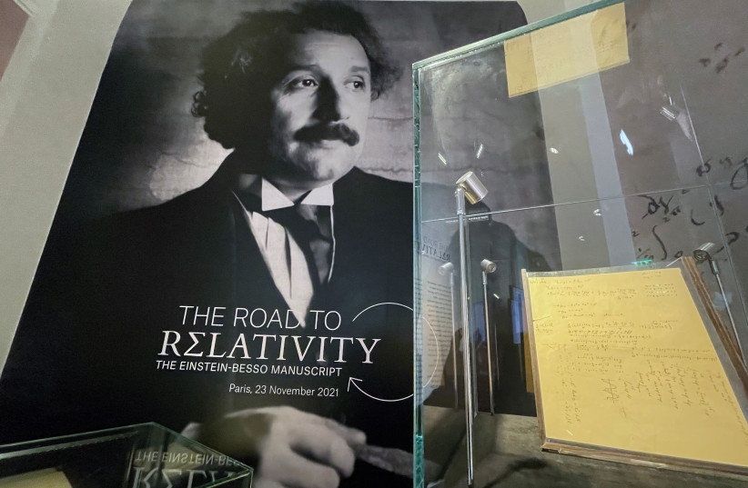  The Einstein-Besso manuscript, a 54-page working manuscript written jointly by Albert Einstein and Michele Besso between June 1913 and early 1914, which documents a crucial stage in the development of the general theory of relativity, is displayed at Christie's auction house in Paris, France. (photo credit: REUTERS/ANTONY PAONE)