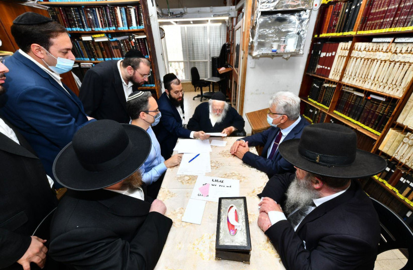  Rabbi Chaim Kanivesky meets with senior medical officials in his Bnei Brak home on Thursday  (credit: SHUKI LERRER)
