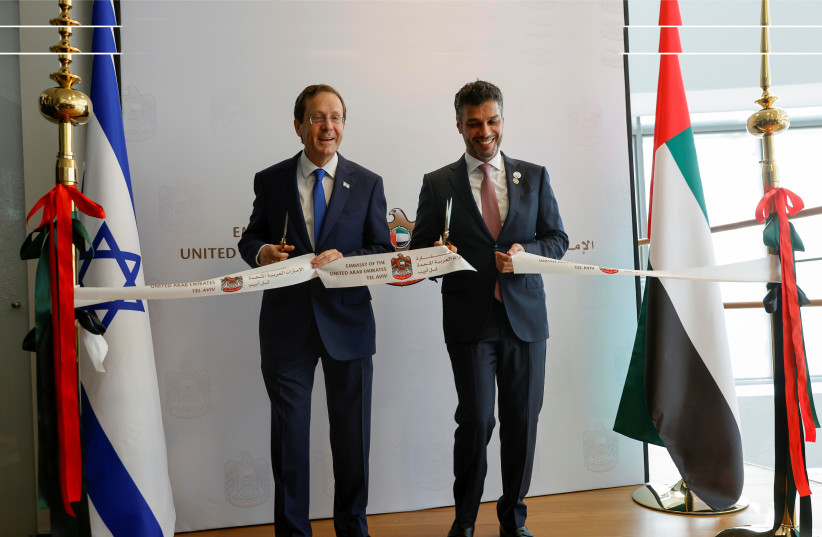   Cutting the ribbon  with President Isaac Herzog at the  July opening of the UAE Embassy, in  Tel Aviv. (photo credit: AMIR COHEN/REUTERS)