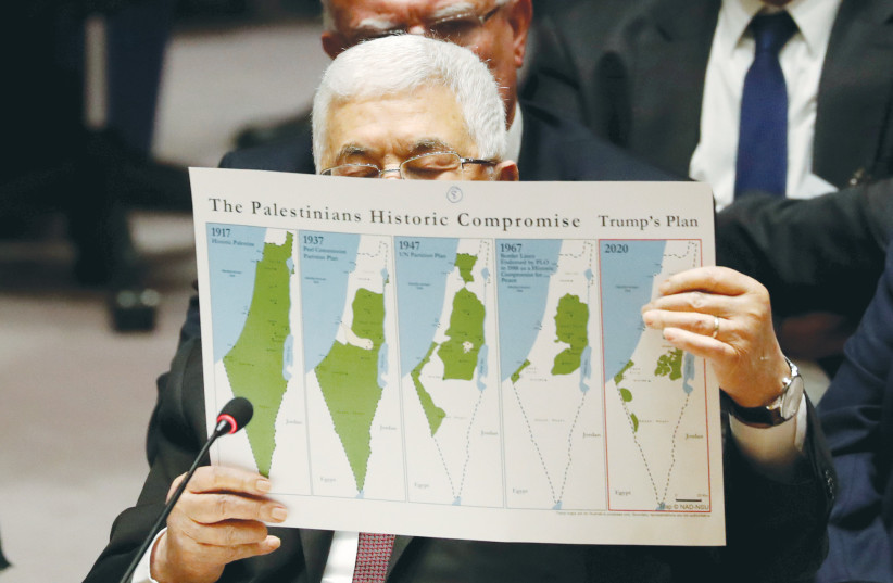  PA PRESIDENT Mahmoud Abbas holds up maps showing the ‘Palestinians’ historic compromise,’ as he addresses the UN Security Council last year.  (credit: SHANNON STAPLETON/ REUTERS)