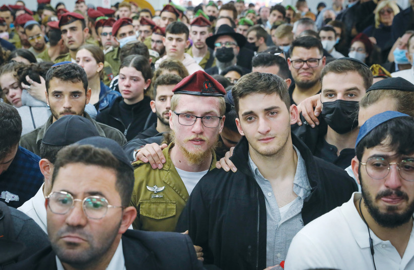 Friends and family attend the funeral of Eli Kay in Jerusalem.  (credit: MARC ISRAEL SELLEM/THE JERUSALEM POST)