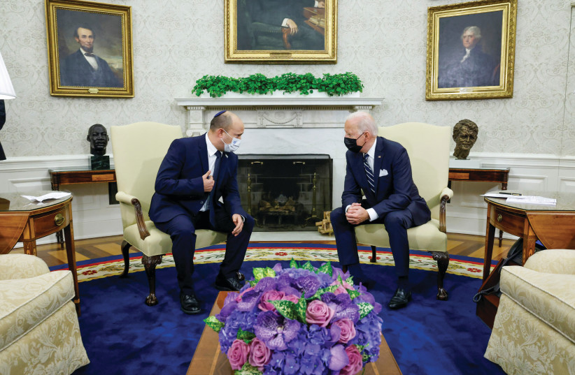  President Joe Biden and Prime Minister Naftali Bennett chat during a meeting in the Oval Office in August. (photo credit: JONATHAN ERNST/REUTERS)