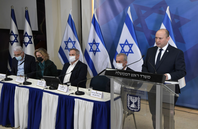  Prime Minister Naftali Bennett speaking in a press conference on the new COVID variant discovered in South Africa on Friday, November 26, 2021 (credit: KOBI GIDEON/GPO)