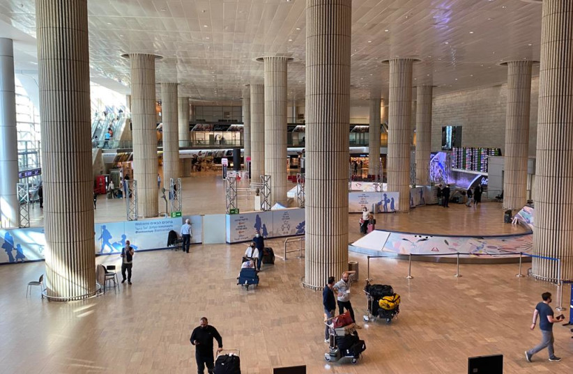  Ben-Gurion Airport in wake of the new travel imposed in light of the COVID Omicron variant, November 28, 2021.  (credit: AVSHALOM SASSONI/MAARIV)