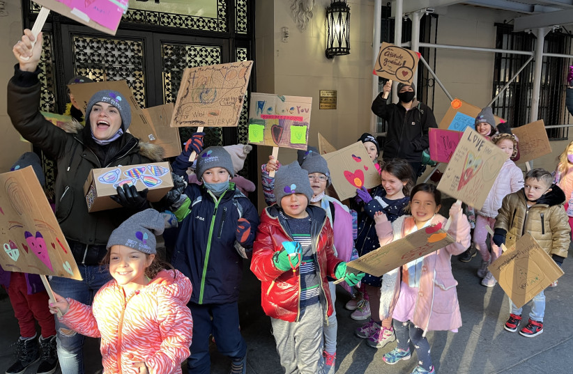  Students and parents from Beit Rabban Day School in Manhattan march to express their gratitude to neighborhood workers on the Upper West Side on the eve of Thanksgiving, Nov. 24, 2021.  (photo credit: COURTESY BEIT RABBAN)