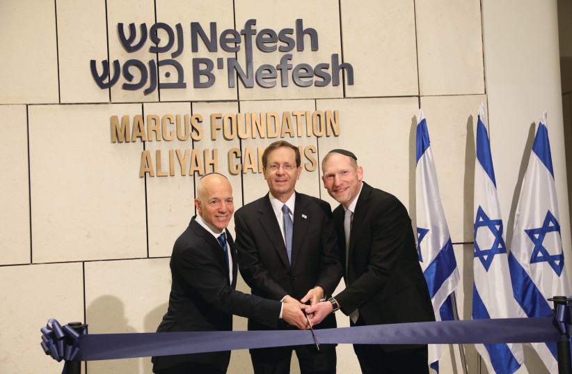  President Isaac Herzog and Nefesh B’Nefesh co-founders Tony Gelbart and Rabbi Yehoshua Fass cut the ribbon at the dedication ceremony of the NBN Aliyah Campus. (photo credit: ELI DASSA)