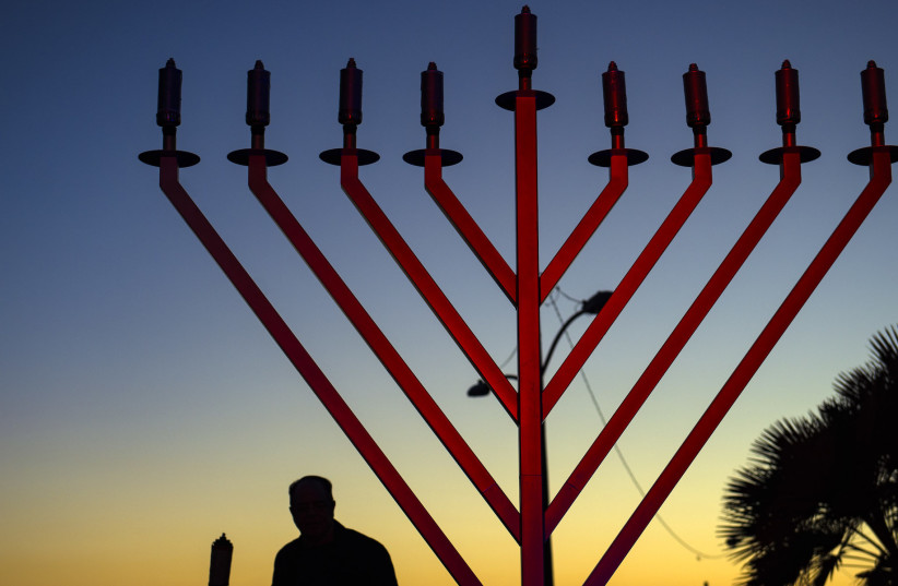  A Chabad menorah, distinguished by the diagonal—rather than curved—arms.  (photo credit: Mindy Schauer/Digital First Media/Orange County Register via Getty Images)