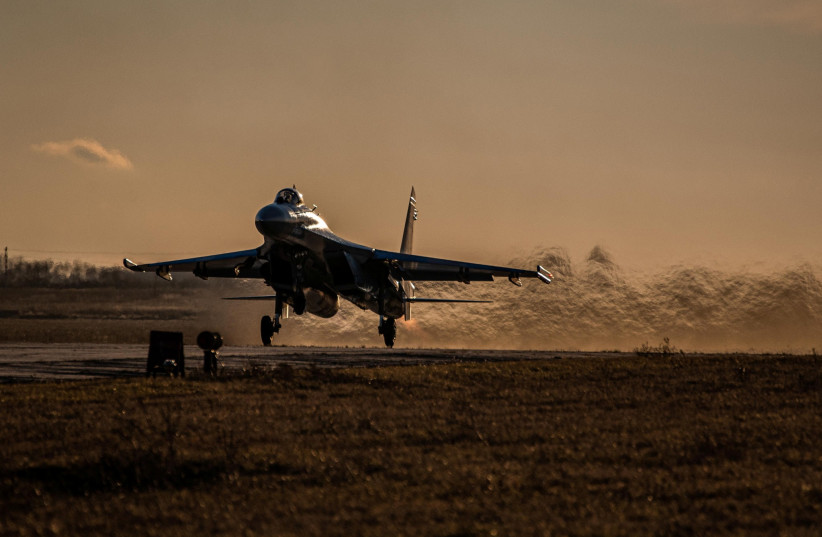 A Ukrainian Air Force fighter jet takes off during a drill in Mykolaiv region in southern Ukraine November 23, 2021. (photo credit: AIR FORCE COMMAND OF UKRAINIAN ARMED FORCES/HANDOUT VIA REUTERS)