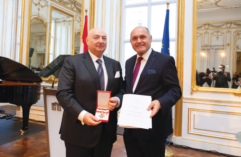  The president of Austria’s parliament, Wolfgang Sobotka, presents the Grand Decoration of Honor in Gold, Austria’s highest award, to Dr. Moshe Kantor, president of the European Jewish Congress, at the Liechtenstein City Palace in Vienna. (photo credit: Ouriel Morgensztern/EJC)