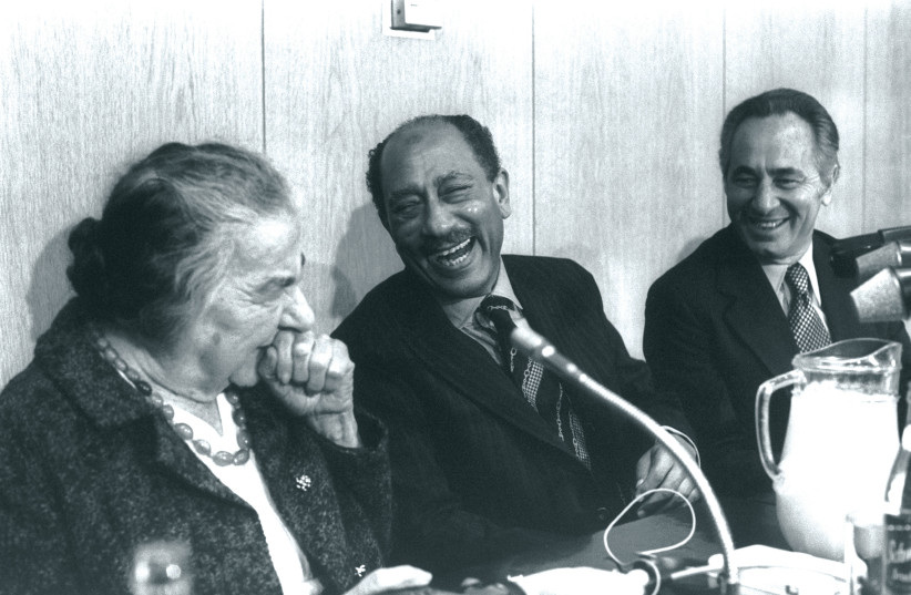  President Sadat shares a laugh with Golda Meir and Shimon Peres in the Knesset on November 21, 1977. (credit: SA’AR YA’ACOV/GPO)