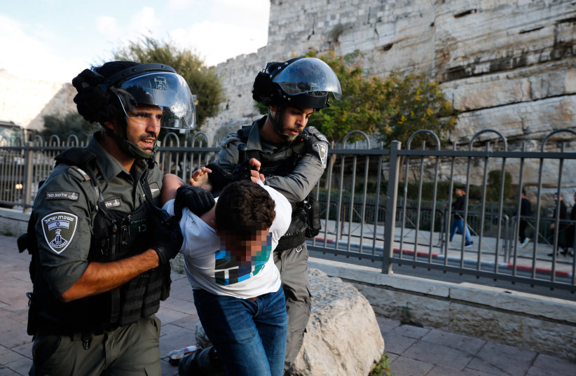  POLICE ARREST a Palestinian youth during a protest at Damascus Gate in Jerusalem’s Old City, October 19. (credit: JAMAL AWAD/FLASH90)