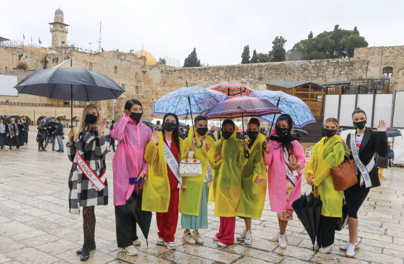  A GROUP OF Miss Universe contestants, looking beautiful and sensible, pose for a photo at the Western Wall this week. (photo credit: MARC ISRAEL SELLEM/THE JERUSALEM POST)