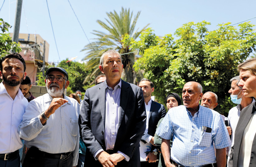 UNRWA COMMISSIONER-GENERAL Philippe Lazzarini visits the Sheikh Jarrah neighborhood in east Jerusalem earlier this year.  (photo credit: AMMAR AWAD/REUTERS)