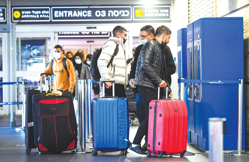  TRAVELERS AT Ben-Gurion Airport this week. (photo credit: AVSHALOM SASSONI/FLASH90)