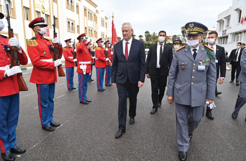  DEFENSE MINISTER Benny Gantz reviews an honor guard with Moroccan Inspector-General of the Armed Forces Belkhir El Farouk, last month in Rabat. (photo credit: Defense Ministry via Reuters)