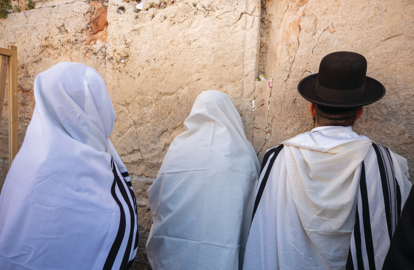 Worshipers pray at the Western Wall. (photo credit: OLIVIER FITOUSSI/FLASH90)
